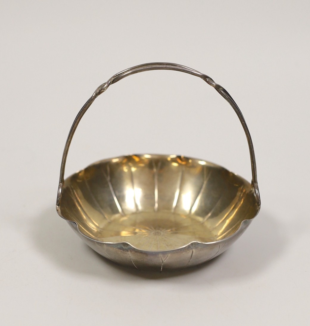 A Chinese white metal lotus leaf sweetmeat basket by Wang Hing, Hong Kong, diameter 10.7cm, 109 grams.